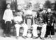 Singapore / Malaysia: Two Baba or Peranakan men with their sons, early 20th century